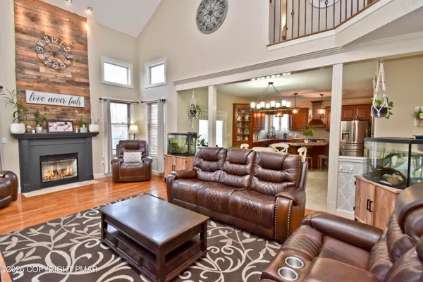 a view of living room with furniture and fireplace