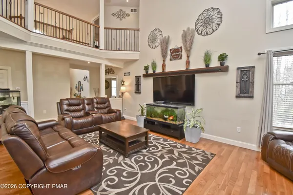 a view of living room with furniture and a fireplace