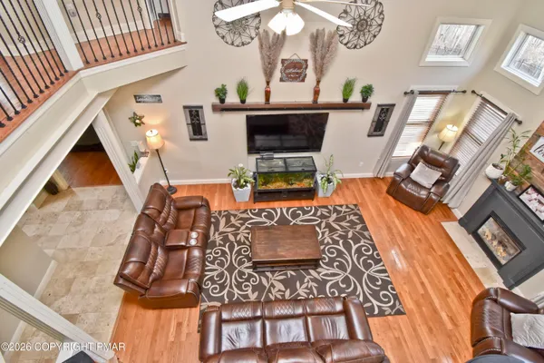 a spacious bathroom with a granite countertop tub sink a mirror a shower and vanity