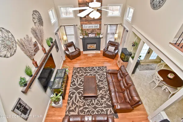 a white toilet sitting next to a shower