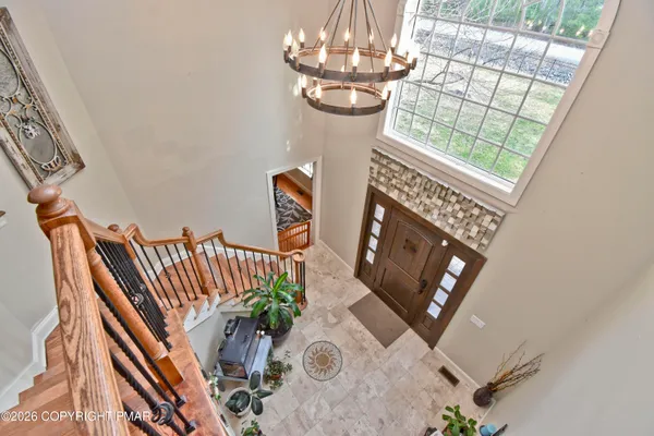 a view of an entryway with wooden floor