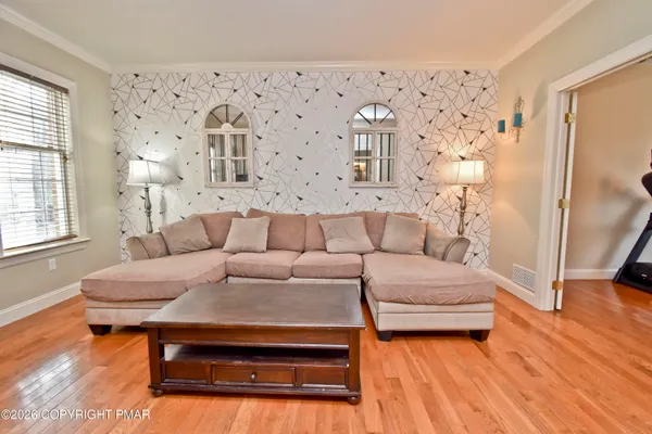 a living room with furniture and a window