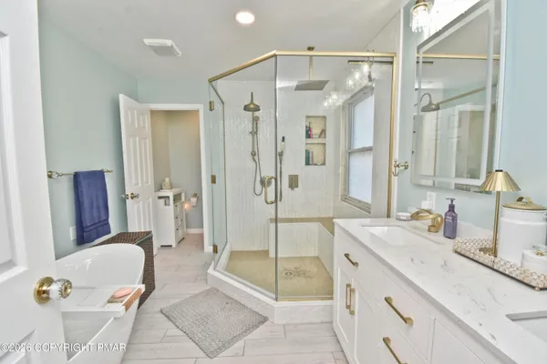 a bedroom with a bed and a television