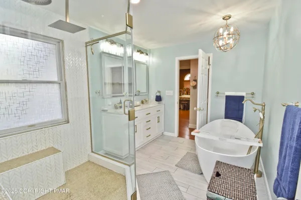 a view of a patio with table and chairs with wooden floor and fence