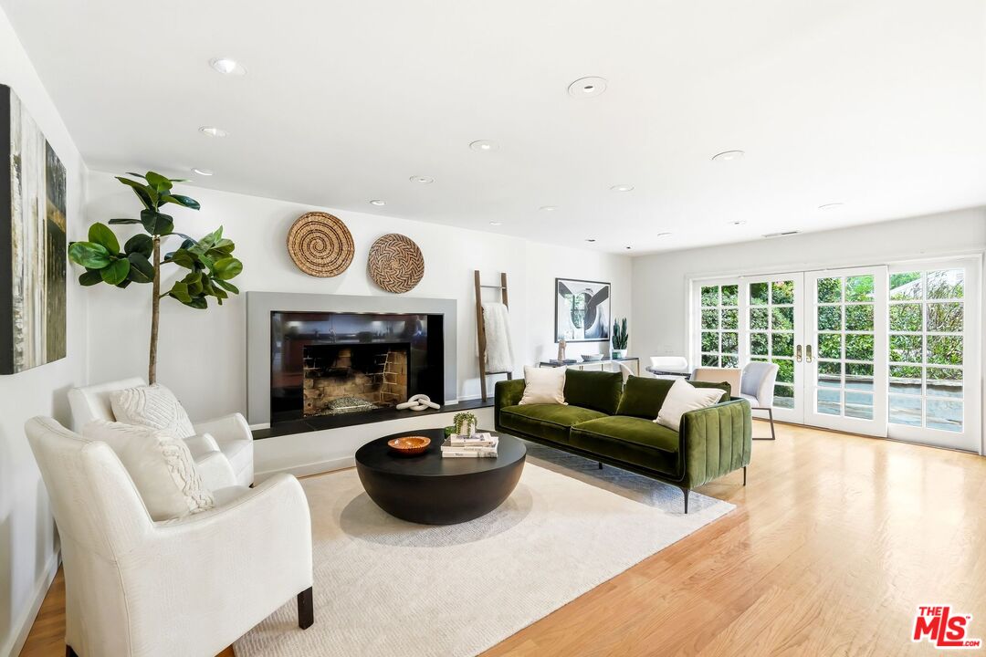 13019 Addison Street Sherman Oaks, CA 91423 - Photo 11 of 28 a living room with furniture and a fireplace
