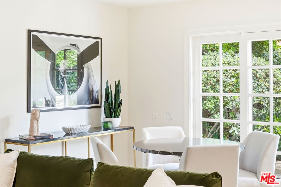 13019 Addison Street Sherman Oaks, CA 91423 - Photo 12 of 28 a living room with furniture and a window