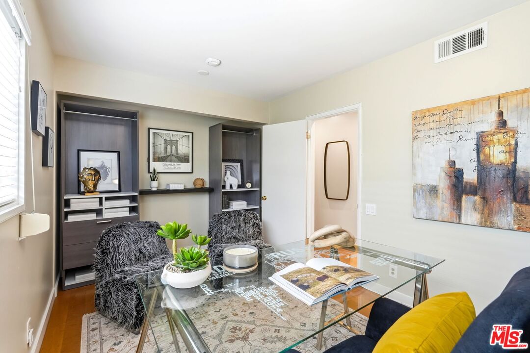 13019 Addison Street Sherman Oaks, CA 91423 - Photo 19 of 28 a living room with furniture and wooden floor
