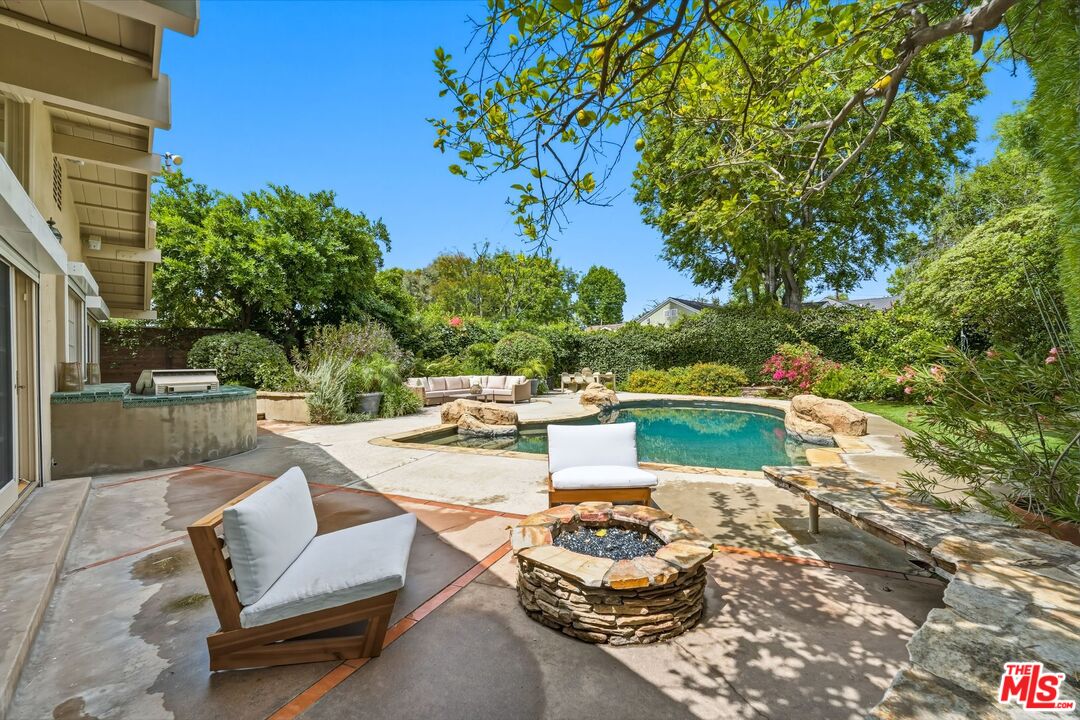 13019 Addison Street Sherman Oaks, CA 91423 - Photo 21 of 28 a view of a patio with couches table and chairs and potted plants