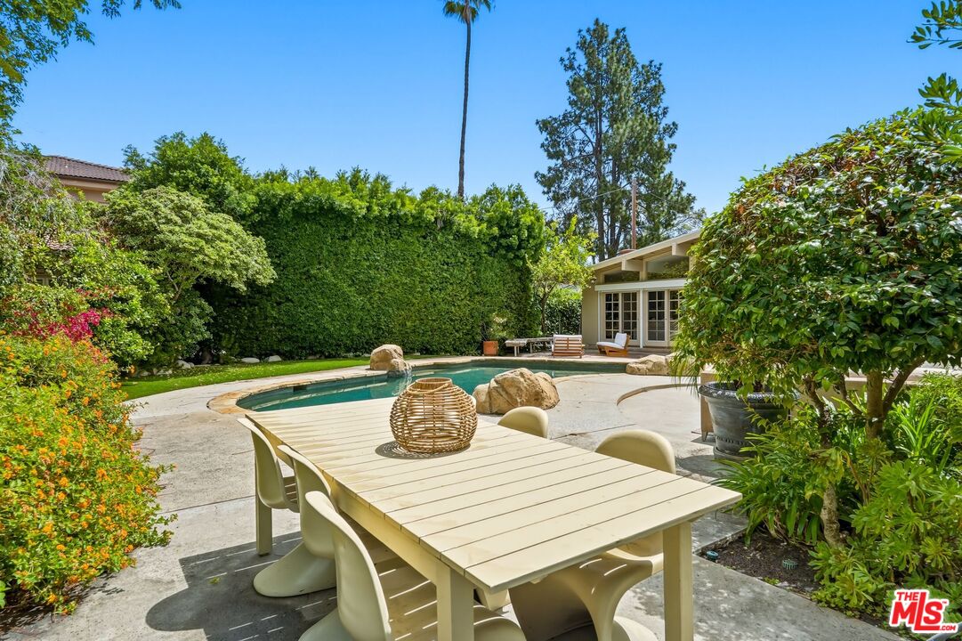 13019 Addison Street Sherman Oaks, CA 91423 - Photo 24 of 28 a view of a dining table and chairs in patio