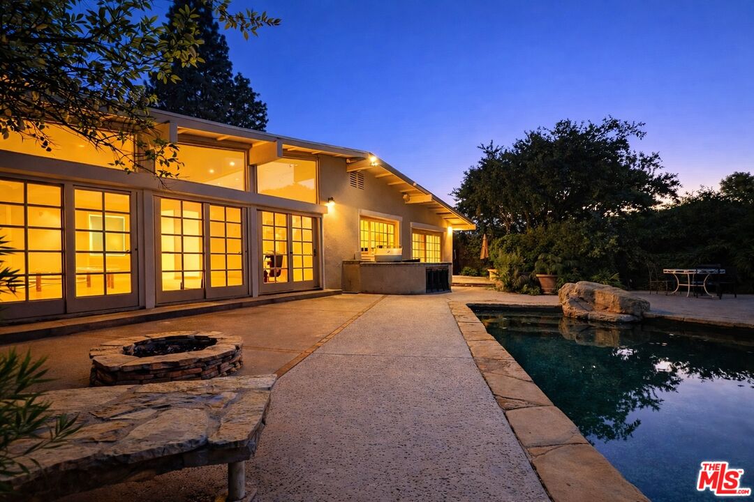 13019 Addison Street Sherman Oaks, CA 91423 - Photo 27 of 28 a house view with a sitting space fire pit and outdoor space