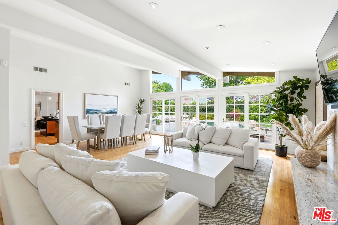 13019 Addison Street Sherman Oaks, CA 91423 - Photo 5 of 28 a living room with furniture and a large window