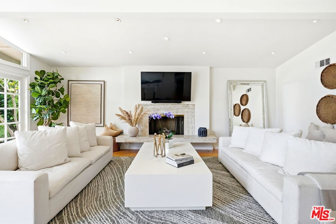 13019 Addison Street Sherman Oaks, CA 91423 - Photo 6 of 28 a living room with furniture and a flat screen tv