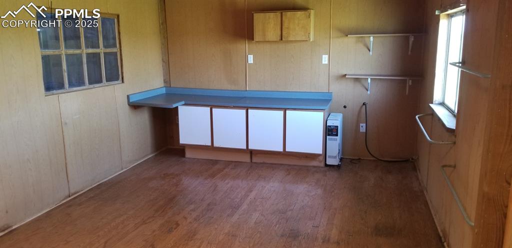 610 Awesome View Yoder, CO 80864 - Photo 21 of 43 an empty room with wooden floor and windows