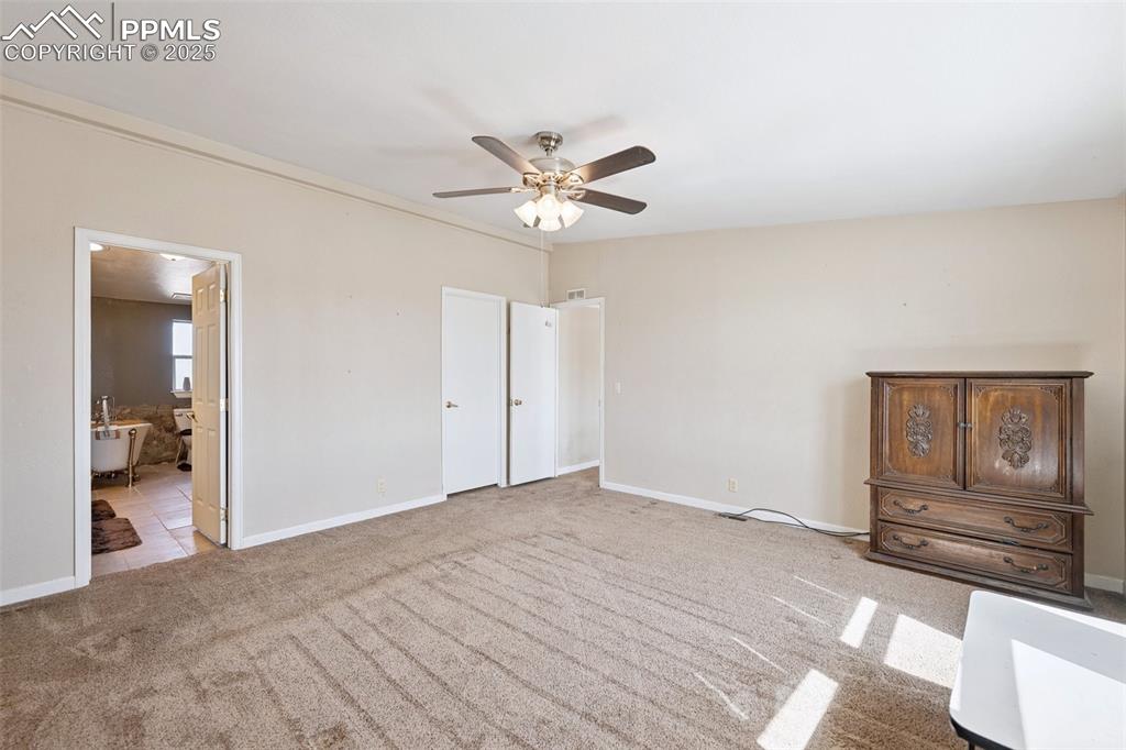 610 Awesome View Yoder, CO 80864 - Photo 33 of 43 a view of a livingroom with a chandelier fan and wooden floor