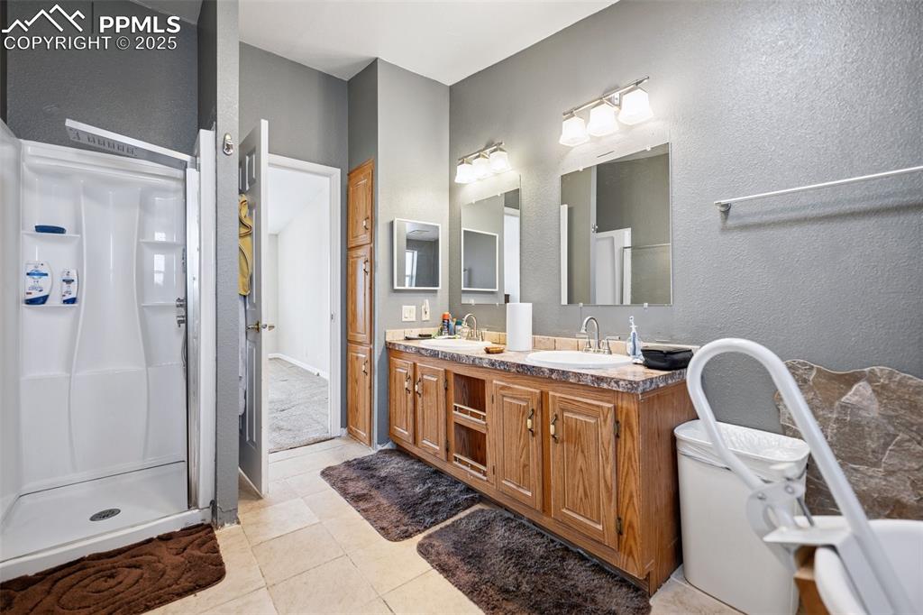 610 Awesome View Yoder, CO 80864 - Photo 36 of 43 a view of bathroom with double vanity and a shower