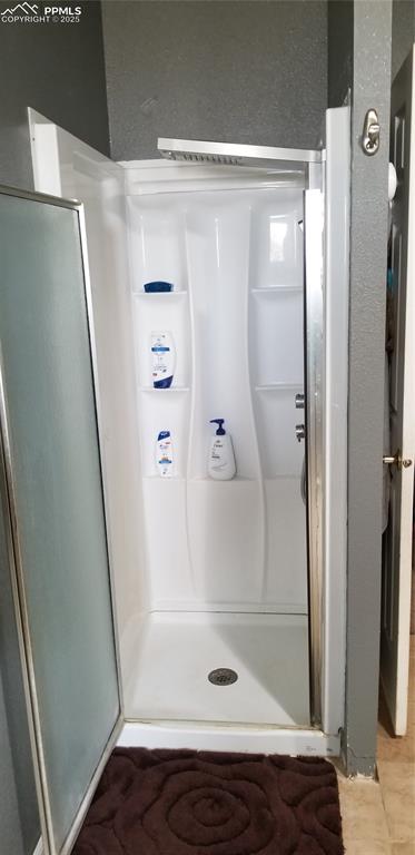 610 Awesome View Yoder, CO 80864 - Photo 37 of 43 a bathroom with a glass door shower