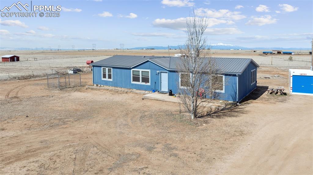 610 Awesome View Yoder, CO 80864 - Photo 4 of 43 a view of a house with a yard and ocean view