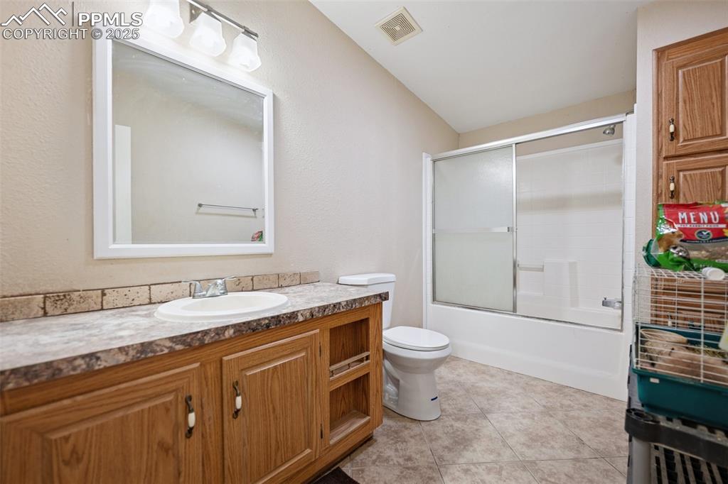 610 Awesome View Yoder, CO 80864 - Photo 41 of 43 a bathroom with a granite countertop sink toilet and shower