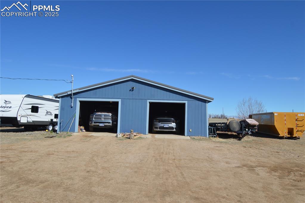 610 Awesome View Yoder, CO 80864 - Photo 9 of 43 a car parked in front of a house
