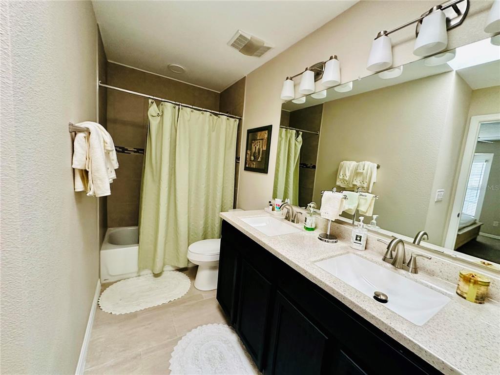 784 South Pennsylvania Avenue Winter Park, FL 32789 - Photo 29 of 29 a bathroom with a double vanity sink mirror and toilet
