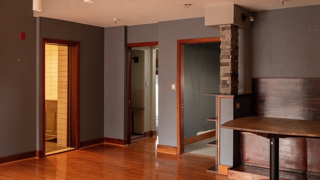 555 South Main Street, Unit 321 Providence, RI 02903 - Photo 14 of 22 a view of a hallway with wooden floor and windows