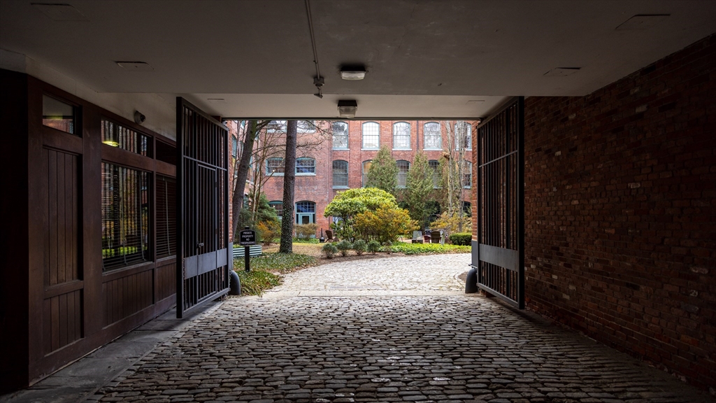 555 South Main Street, Unit 321 Providence, RI 02903 - Photo 2 of 22 a view of a glass door shower and wooden floor