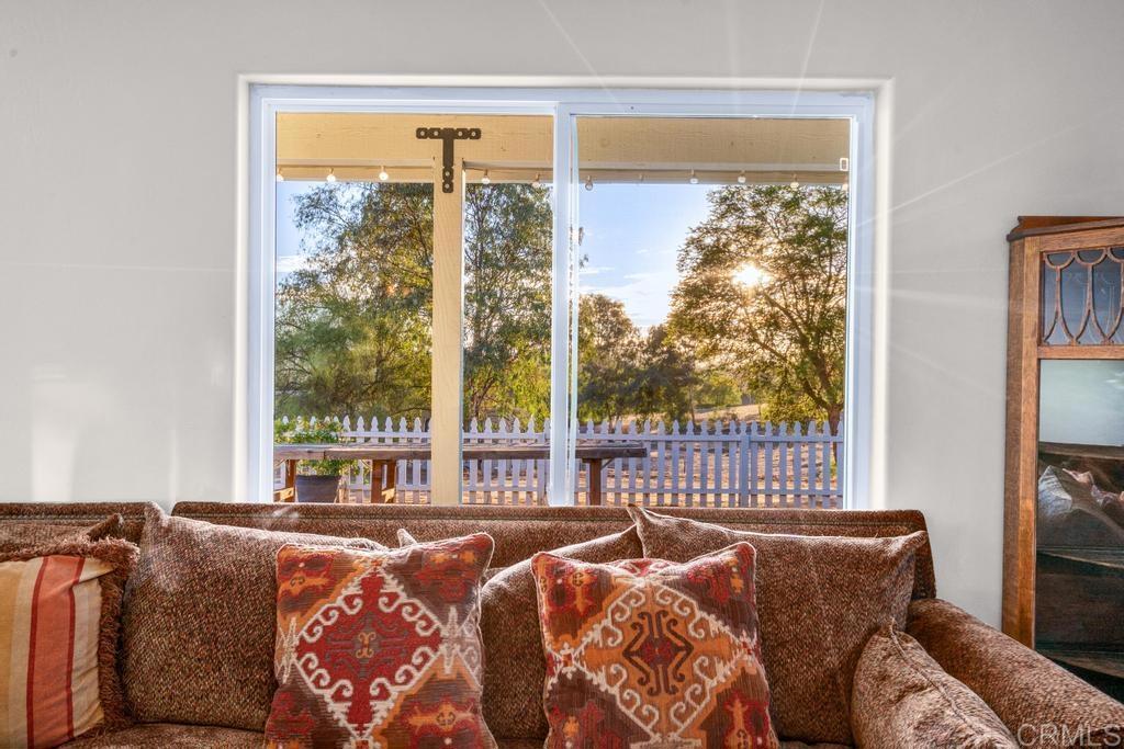 2043 Pamo Road Ramona, CA 92065 - Photo 17 of 63 a bedroom with bed and a large window