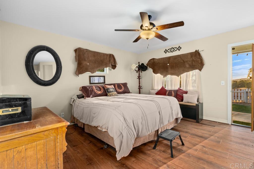 2043 Pamo Road Ramona, CA 92065 - Photo 18 of 63 a bedroom with a bed and a ceiling fan