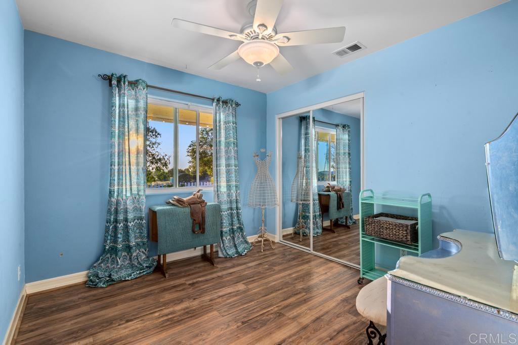 2043 Pamo Road Ramona, CA 92065 - Photo 21 of 63 a living room with furniture and wooden floor