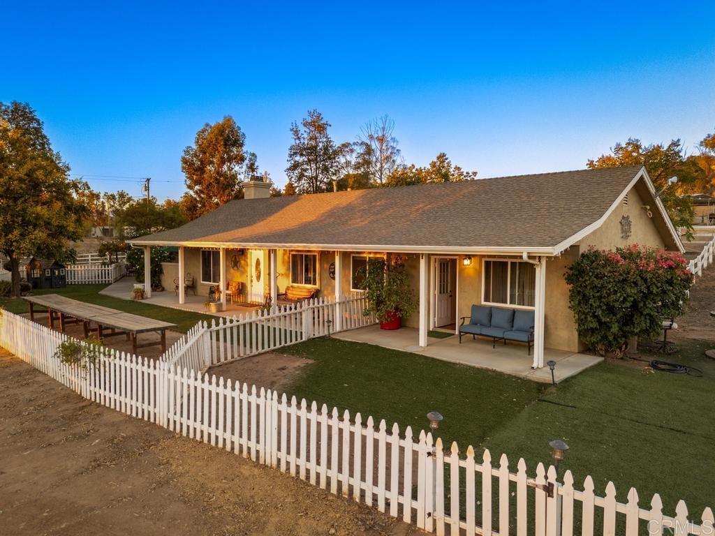 2043 Pamo Road Ramona, CA 92065 - Photo 25 of 63 a front view of a house with a yard