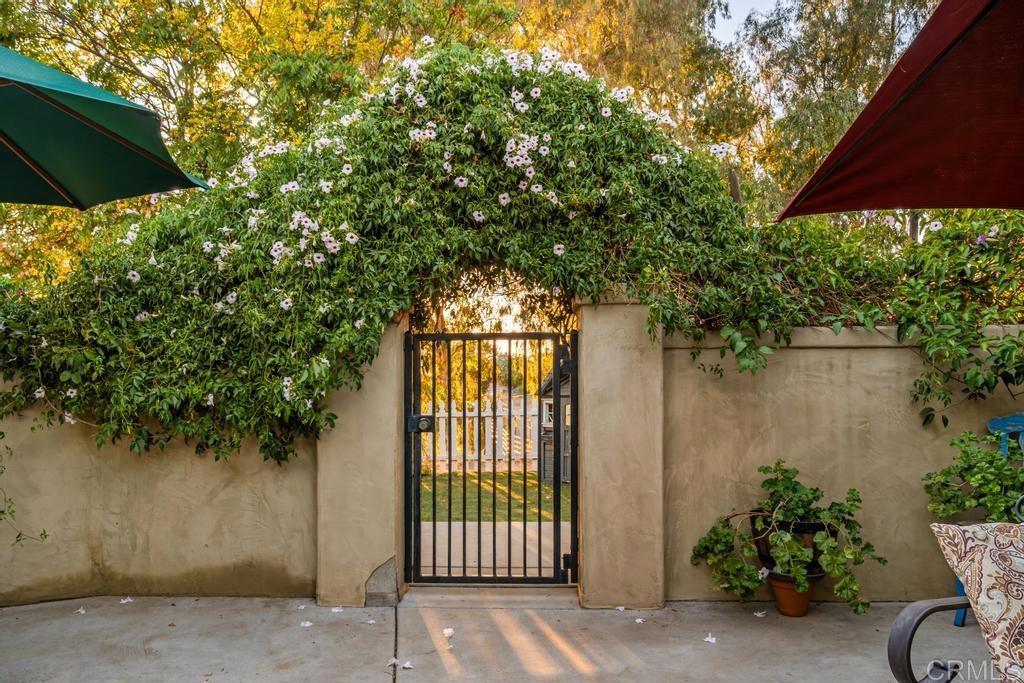 2043 Pamo Road Ramona, CA 92065 - Photo 26 of 63 a backyard of a house with plants and outdoor seating