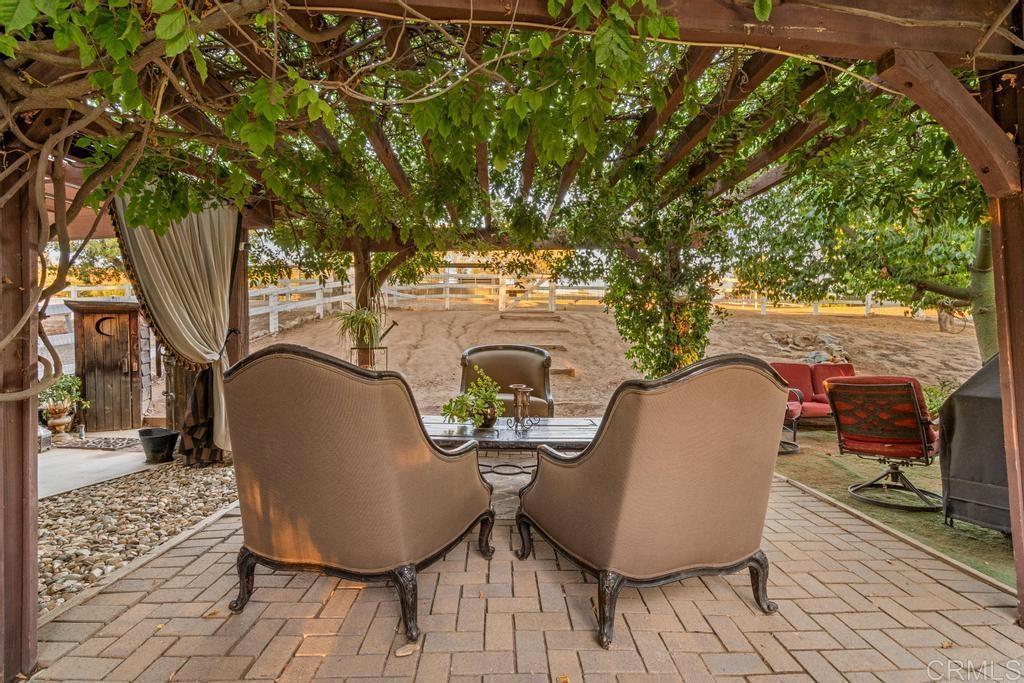 2043 Pamo Road Ramona, CA 92065 - Photo 29 of 63 a view of a chairs and table in the patio