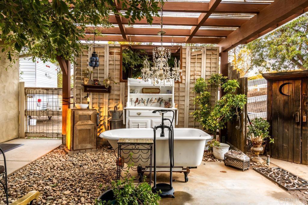 2043 Pamo Road Ramona, CA 92065 - Photo 31 of 63 a building outdoor space with patio furniture and potted plants