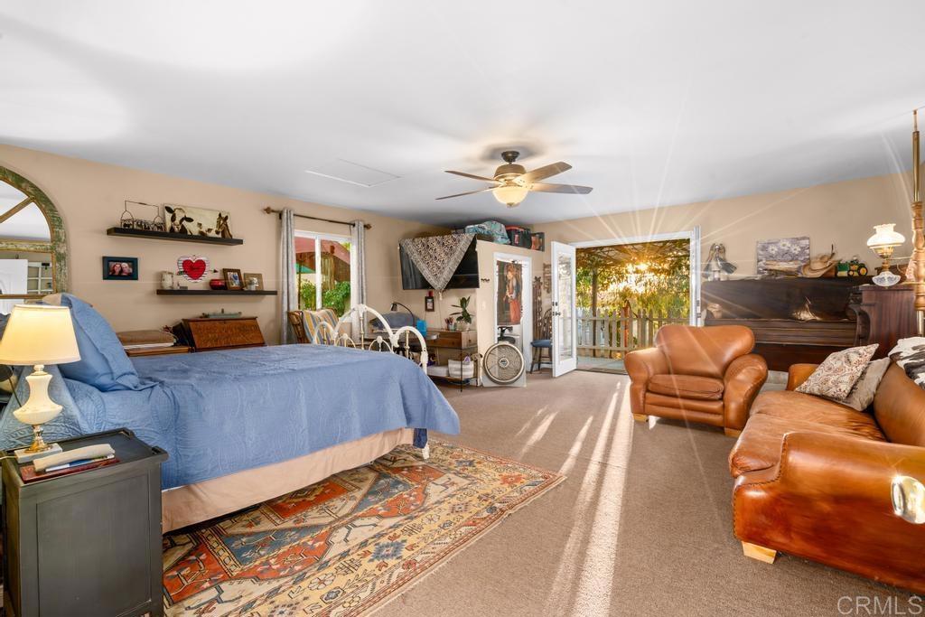 2043 Pamo Road Ramona, CA 92065 - Photo 34 of 63 a bedroom with furniture and a flat screen tv