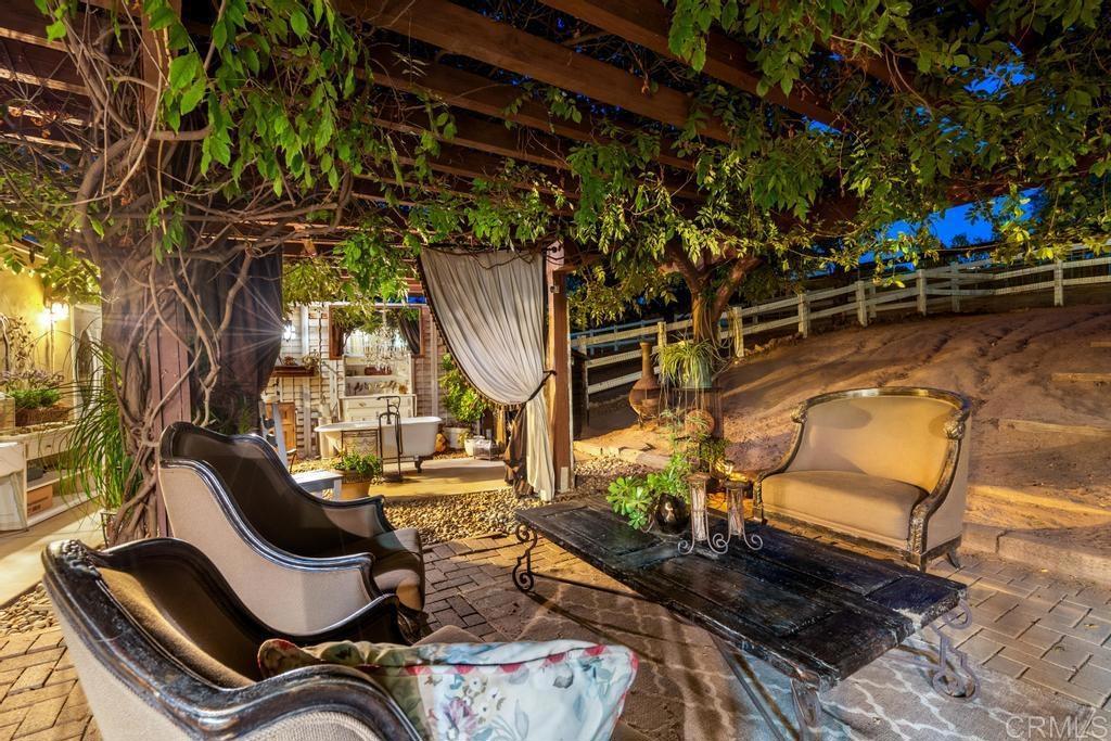 2043 Pamo Road Ramona, CA 92065 - Photo 56 of 63 a view of a chairs and table in the patio