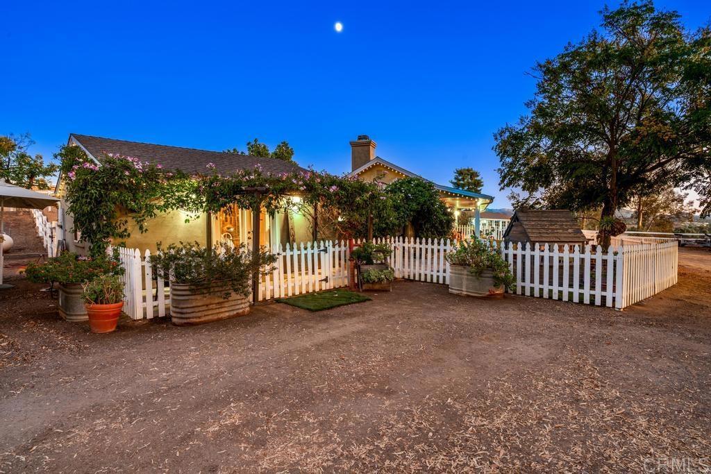 2043 Pamo Road Ramona, CA 92065 - Photo 58 of 63 a view of a house with a backyard porch and furniture