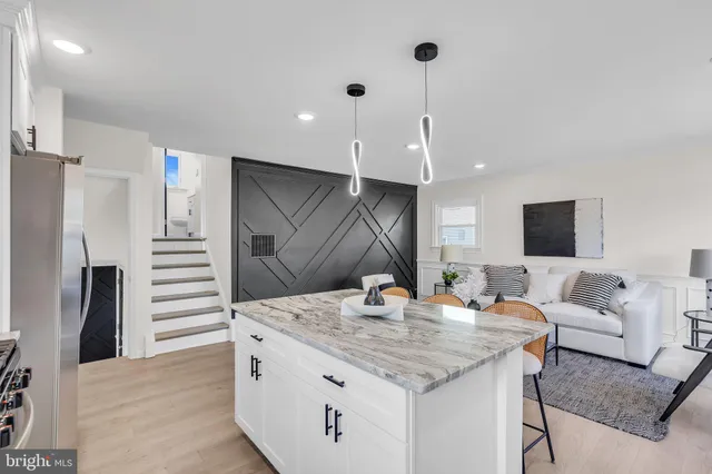 a view of staircase with white walls and a window