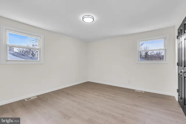 a bedroom with a bed and a night lamp