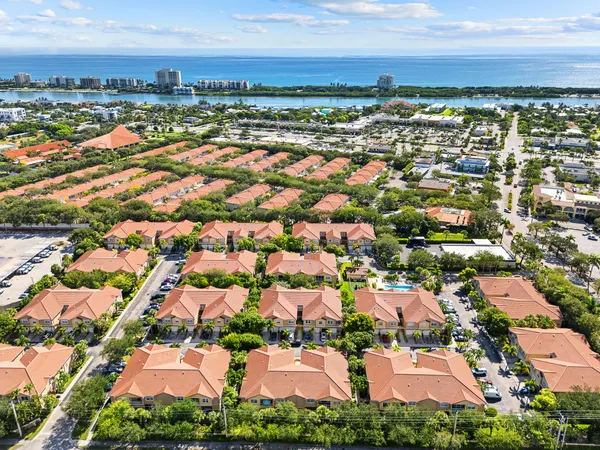 an aerial view of residential houses with outdoor space