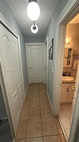 a bedroom with a bed and a ceiling fan