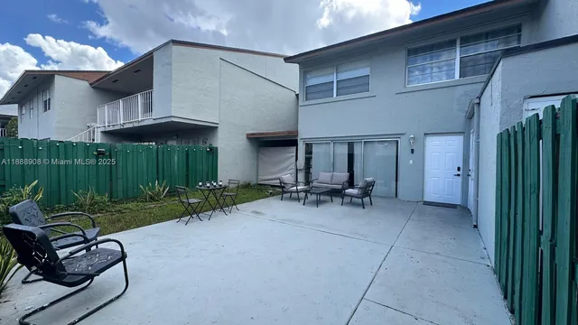 a living room with furniture and a yard