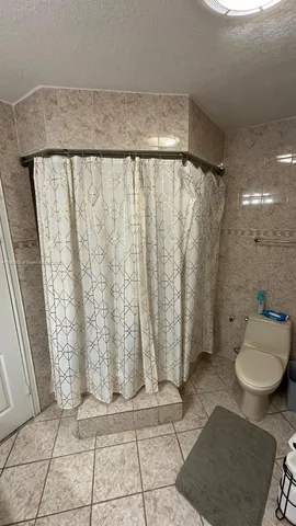 a view of a balcony with furniture