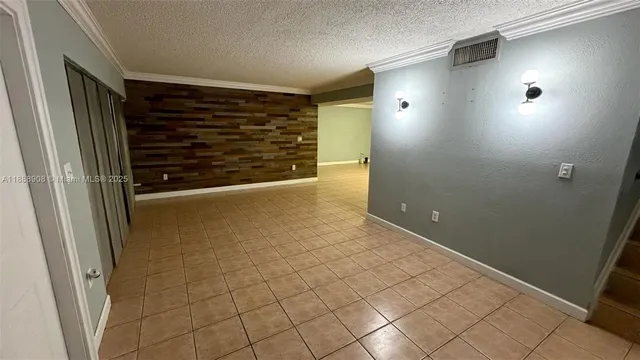 a view of a porch with furniture and a yard