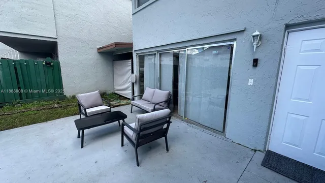 a view of a livingroom with furniture and a mirror