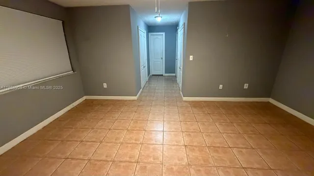 a view of a kitchen with a sink and cabinets