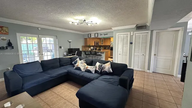 a dining hall with stainless steel appliances granite countertop a granite counter tops and a view of living room