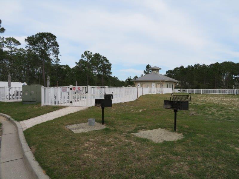 231 Somerset Bridge Road, Unit 2401 Santa Rosa Beach, FL 32459 - Photo 20 of 22 a front view of a house with a yard