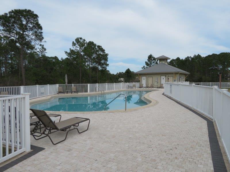 231 Somerset Bridge Road, Unit 2401 Santa Rosa Beach, FL 32459 - Photo 21 of 22 a view of a terrace with a bench and a couch