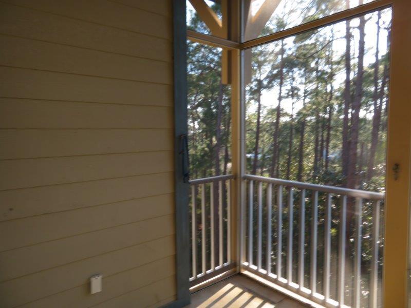 231 Somerset Bridge Road, Unit 2401 Santa Rosa Beach, FL 32459 - Photo 10 of 22 a view of balcony with tree