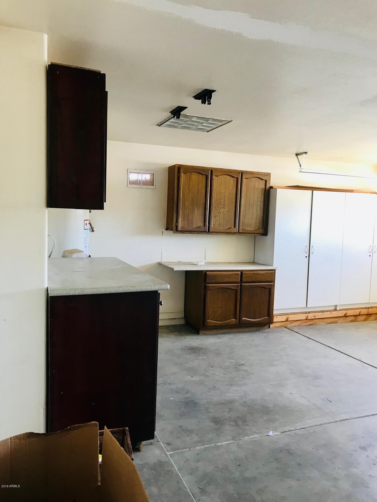 220 West Vineyard Road Phoenix, AZ 85041 - Photo 62 of 67 LG GARAGE, CABINETS